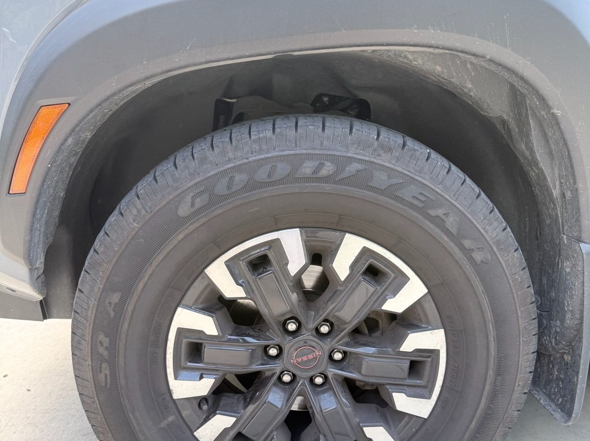 Before — Nissan Frontier wheel and tire exterior detail