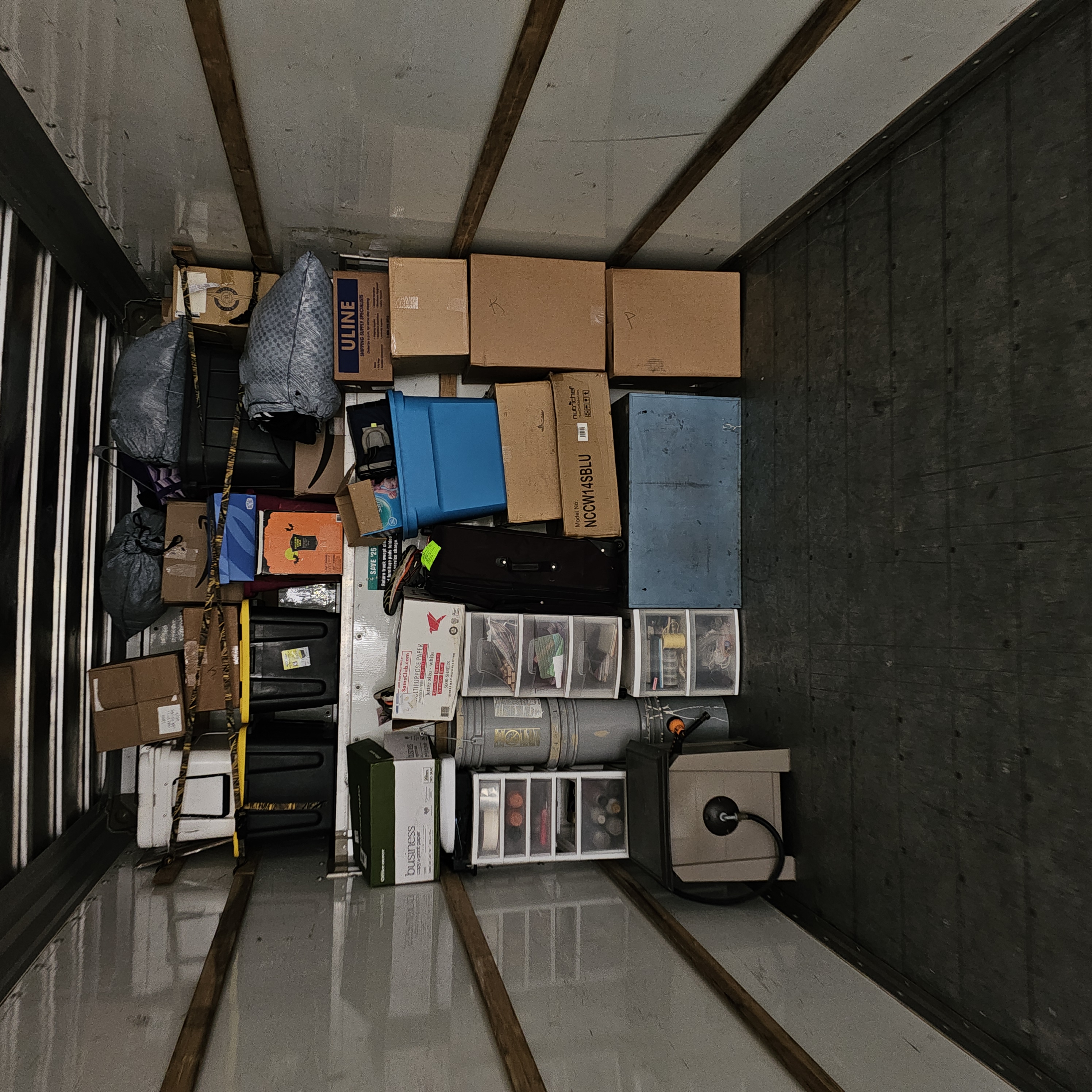 Painless Path Movers crew loading tightly packed moving totes and boxes into a truck