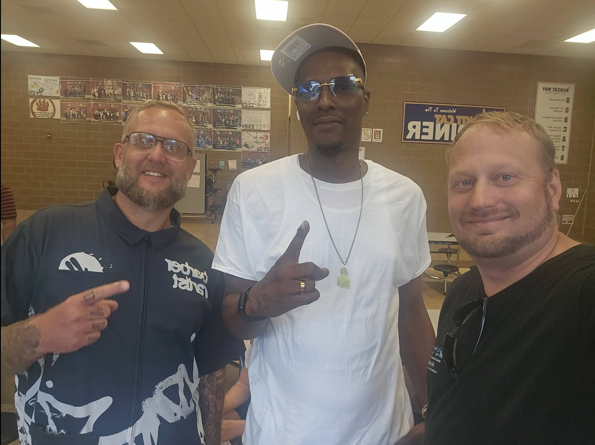 Painless Path Movers crew with barber at the Skill Cutz back-to-school free haircuts event