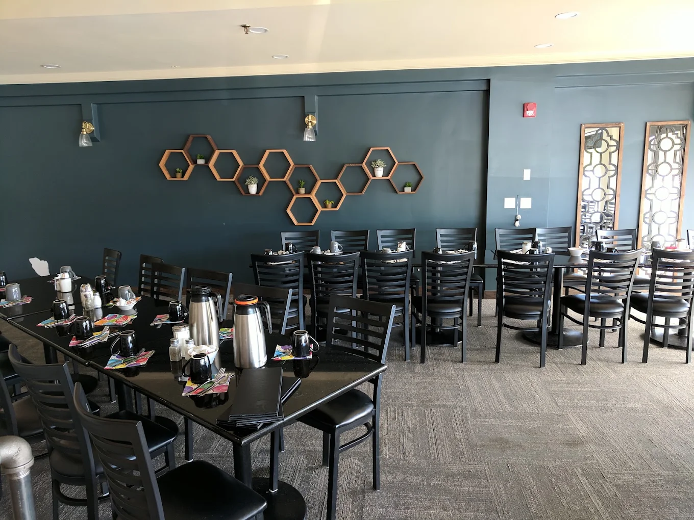 Private dining room feature wall with honeycomb shelves