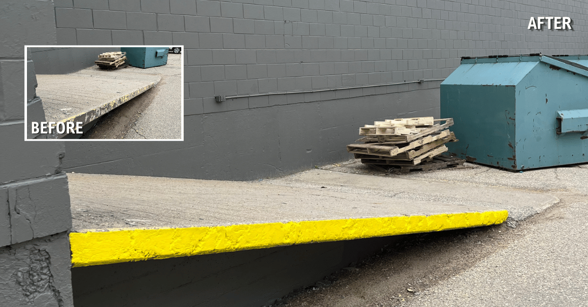 Safety yellow painted loading dock edge with ramp in Winnipeg