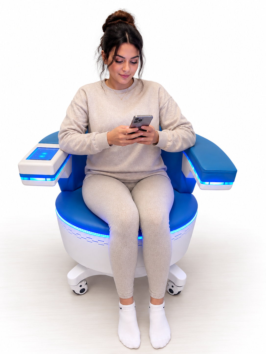 Woman comfortably seated in the Venus Kegel Happy Throne for non-invasive pelvic floor stimulation
