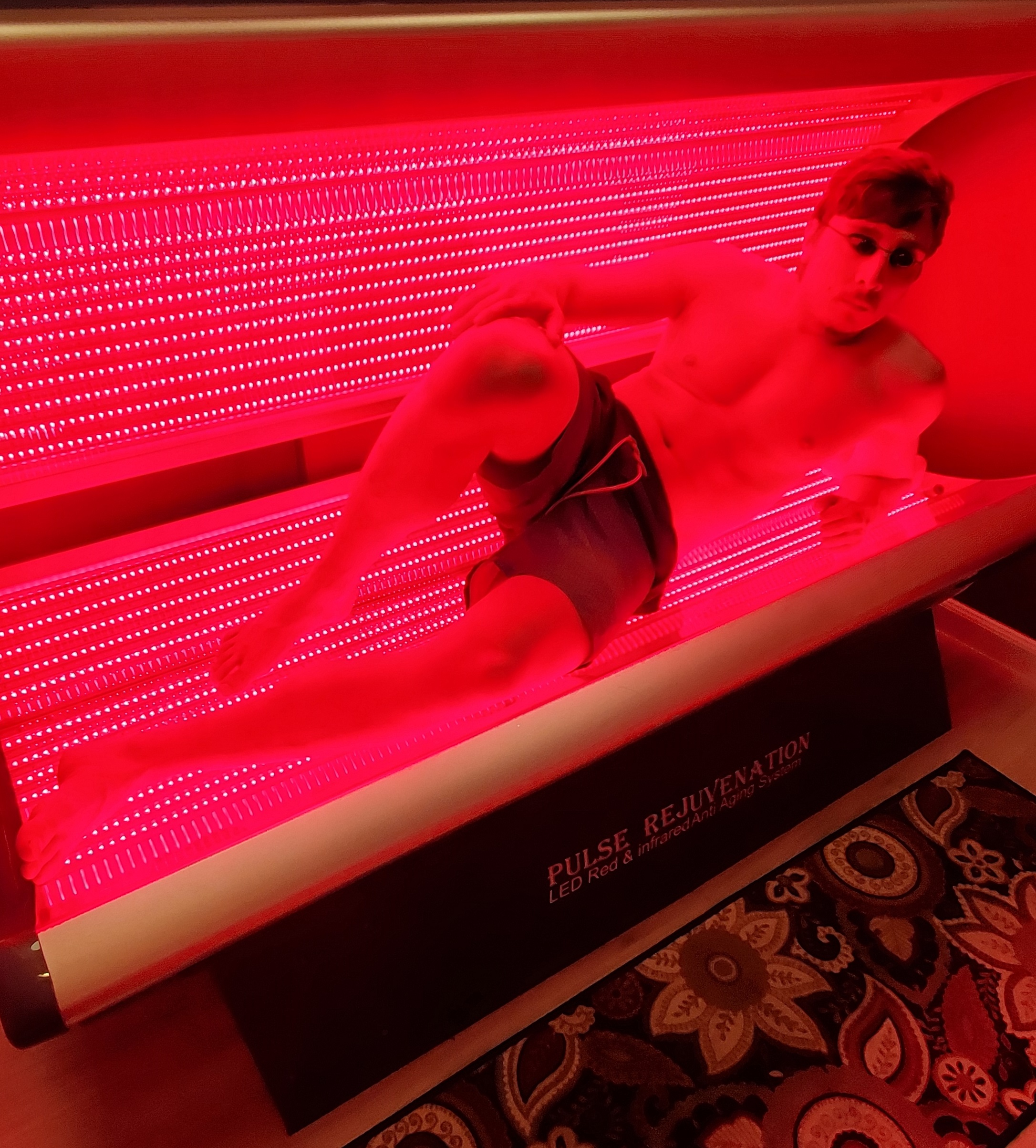 Full-body Pulse Rejuvenation red and infrared LED light therapy bed in session
