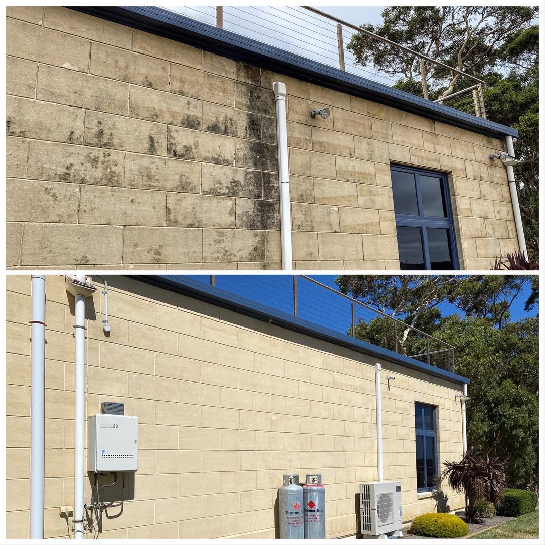Before and after of masonry block exterior wall restored with soft washing