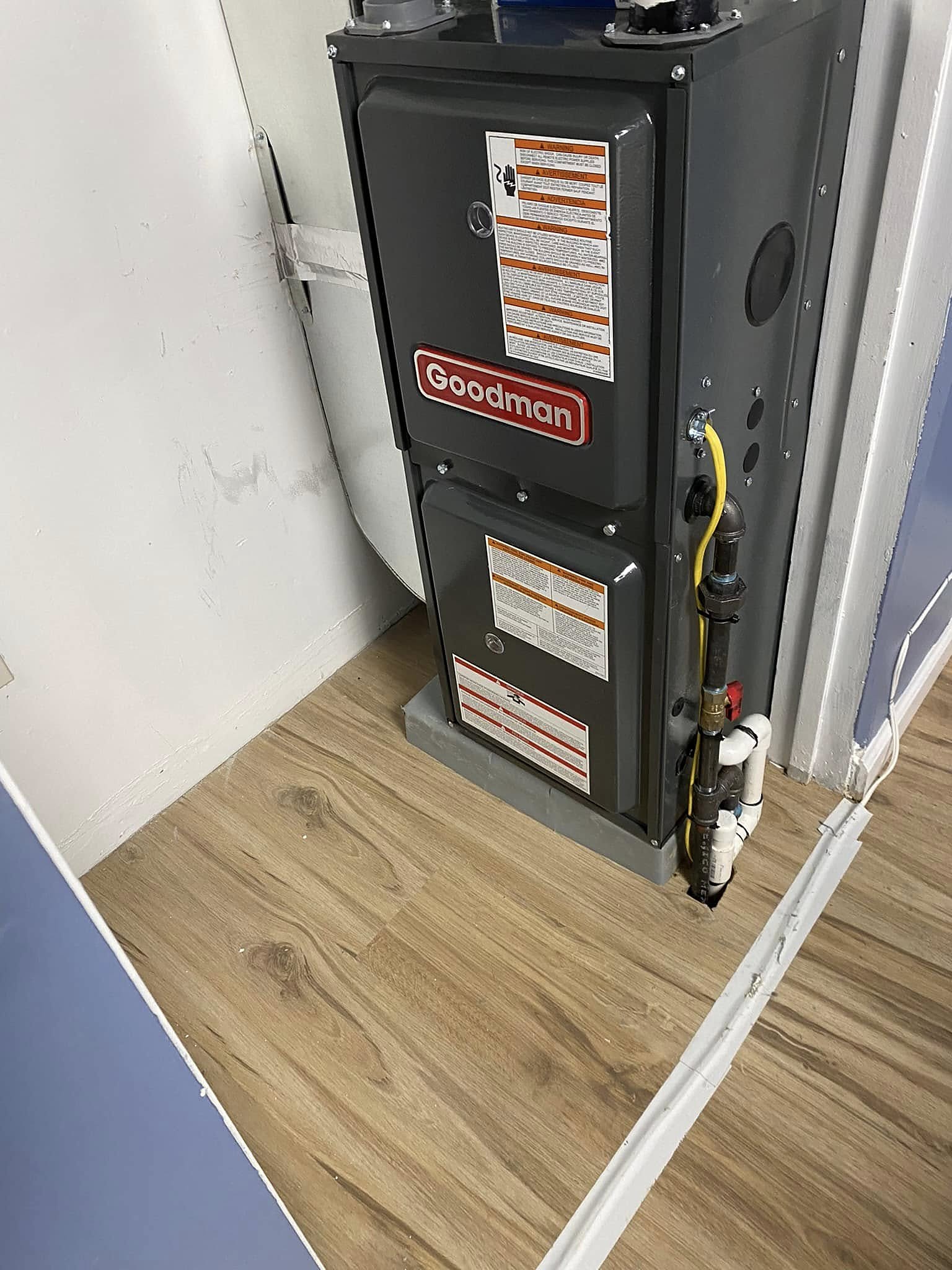 Residential gas furnace installed in a home utility space