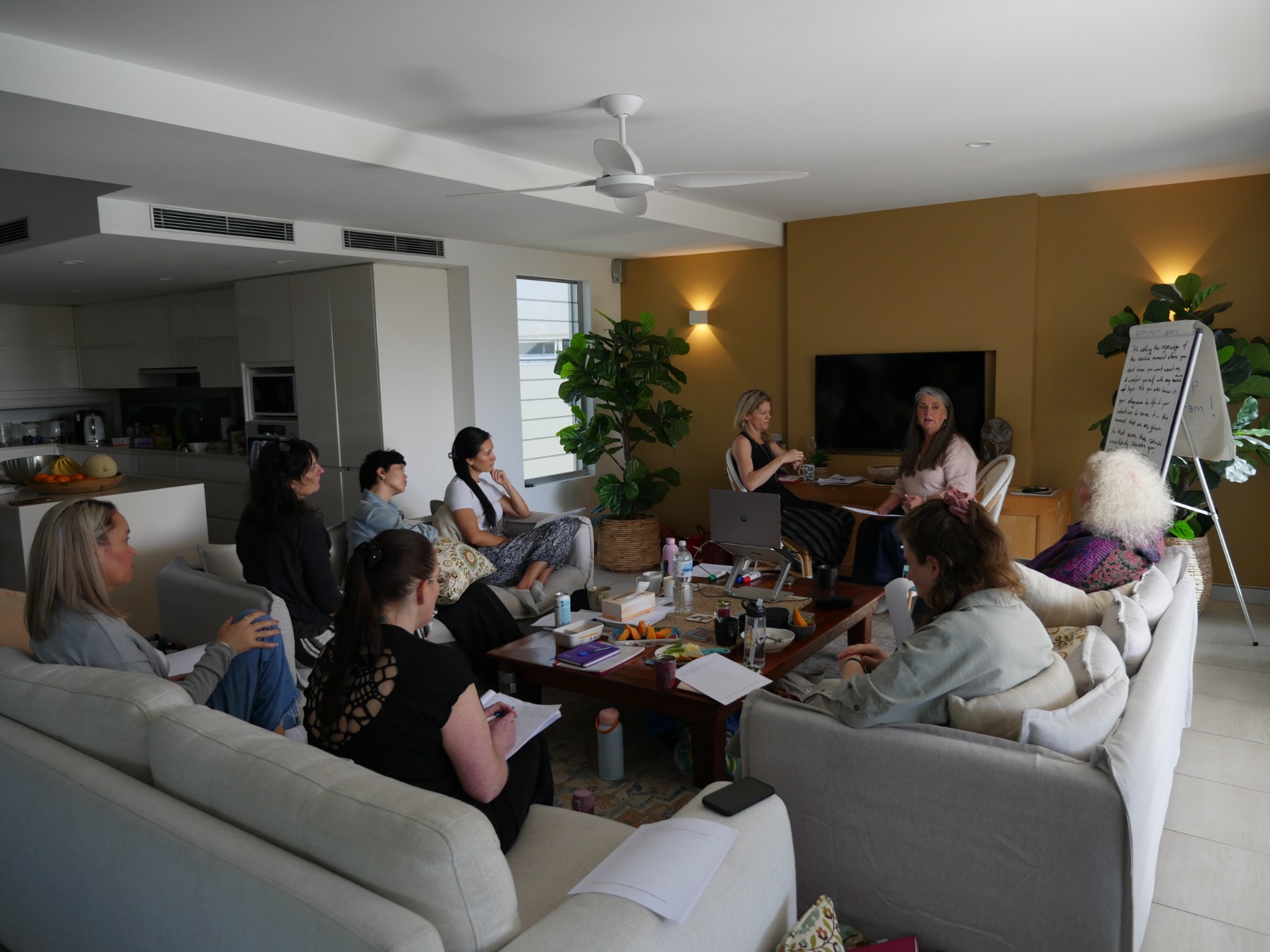 Shari leading a group session in a warm room