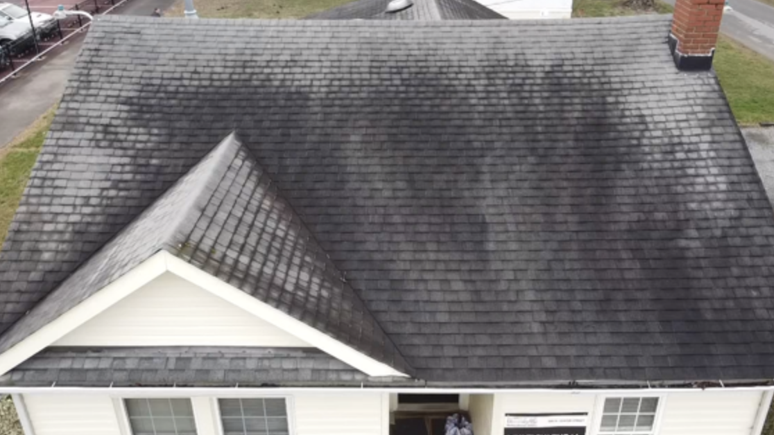 Close-up of the same aging, dried and brittle asphalt shingles before rejuvenation