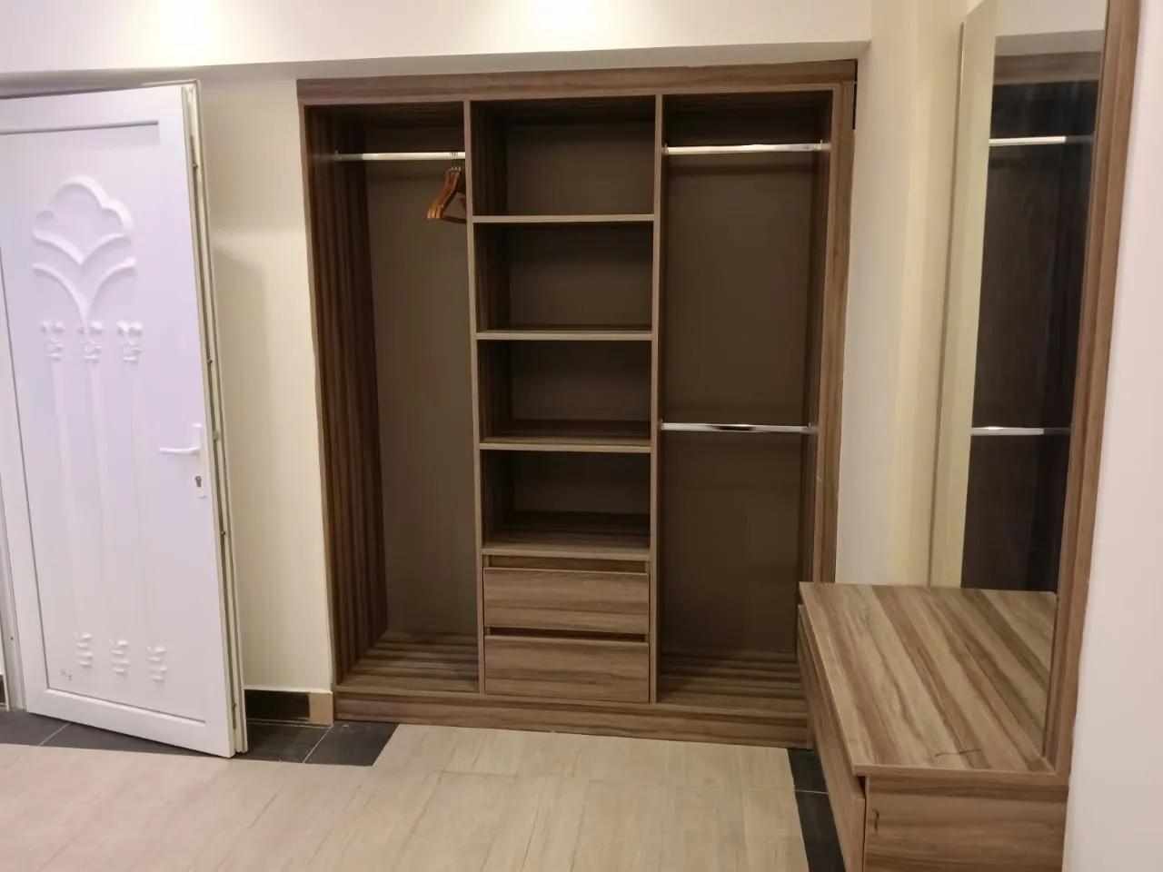 Wardrobe in a room at Royal Hotel Apartments, Al Amerat