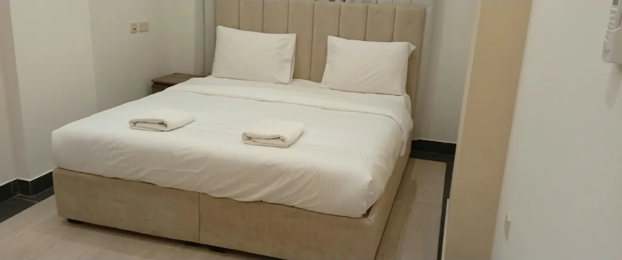 Queen bed room at Royal Hotel Apartments, Al Amerat