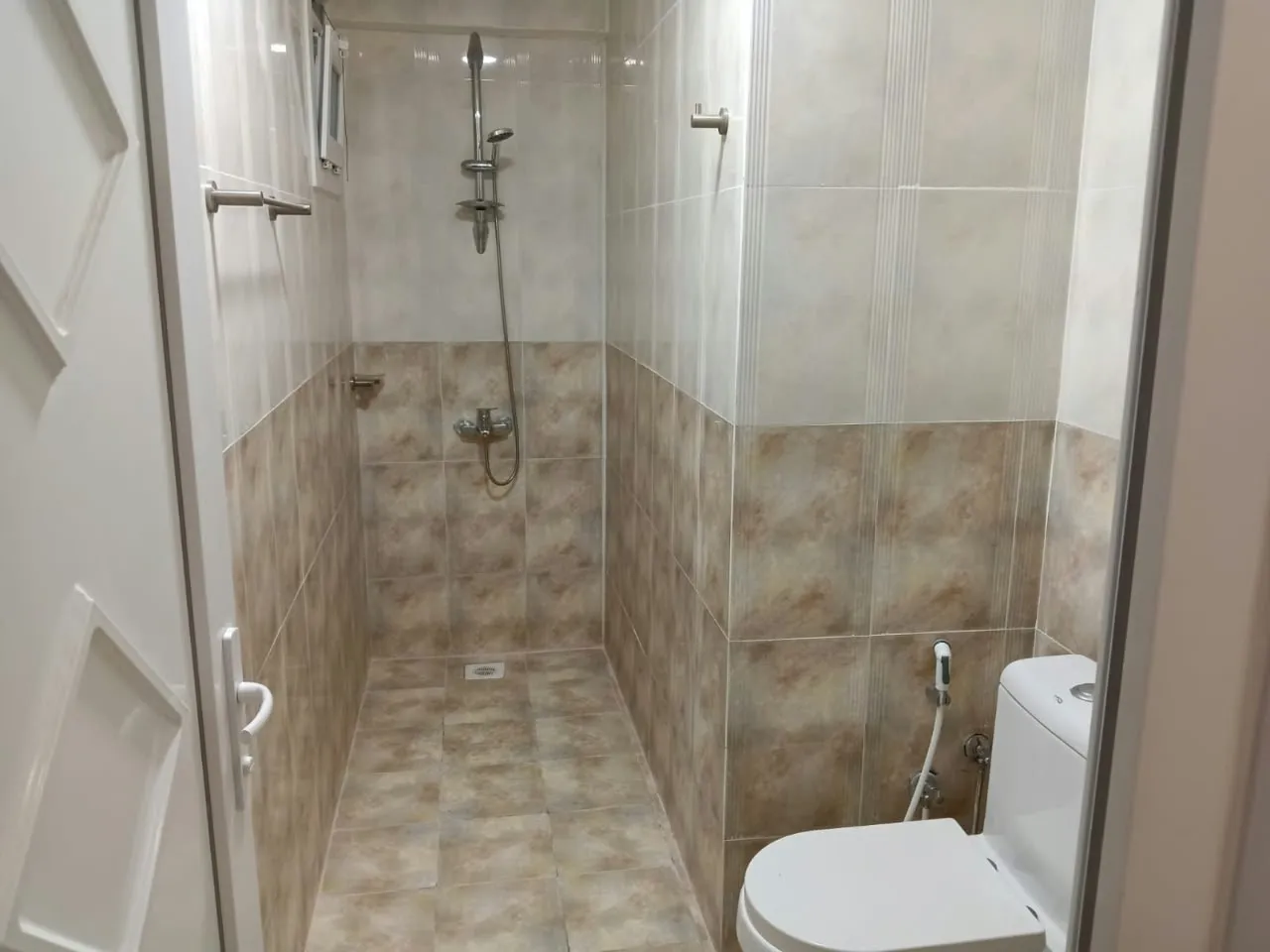 Washroom with shower at Royal Hotel Apartments, Al Amerat