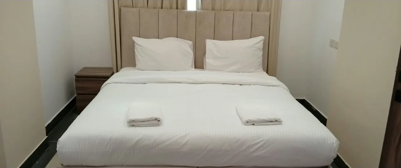 Queen bed room at Royal Hotel Apartments, Al Amerat, front view