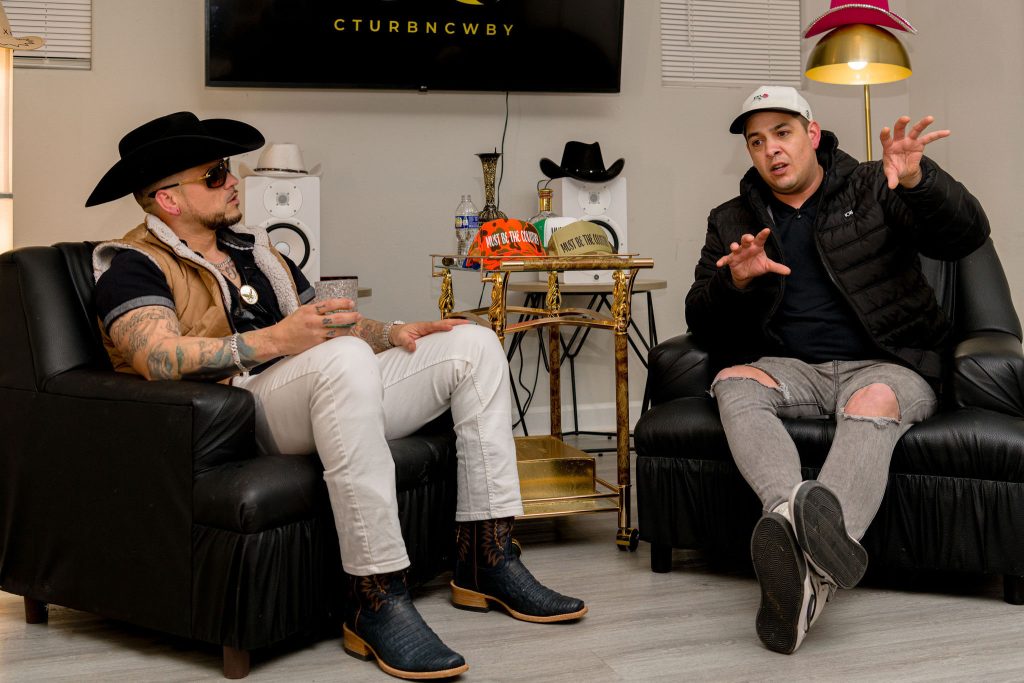 Steven Legacy seated in conversation in a studio for Hip-Hop Paradise