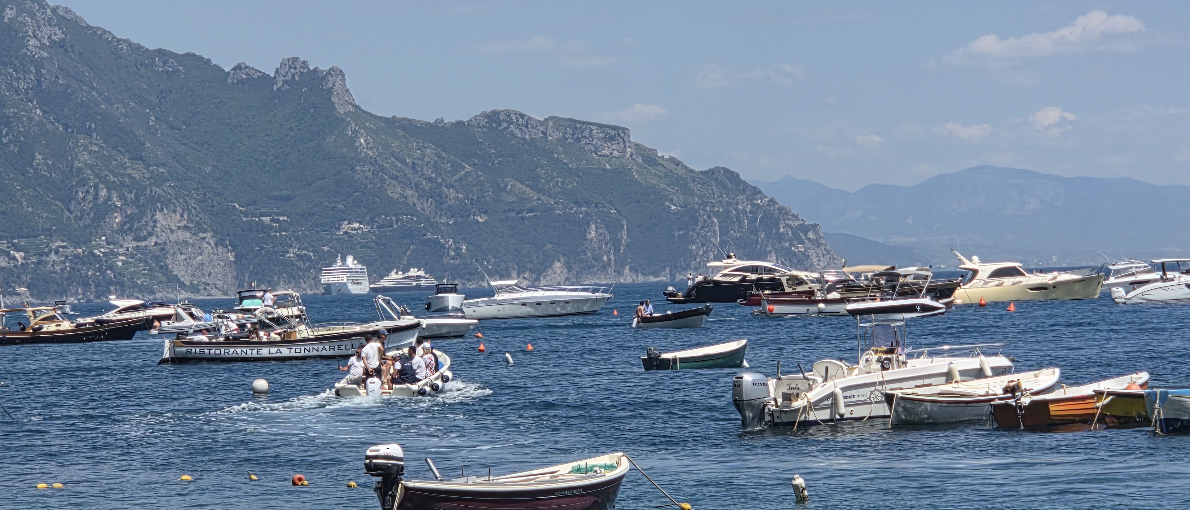 Boats and cruise ships along the Mediterranean coastline