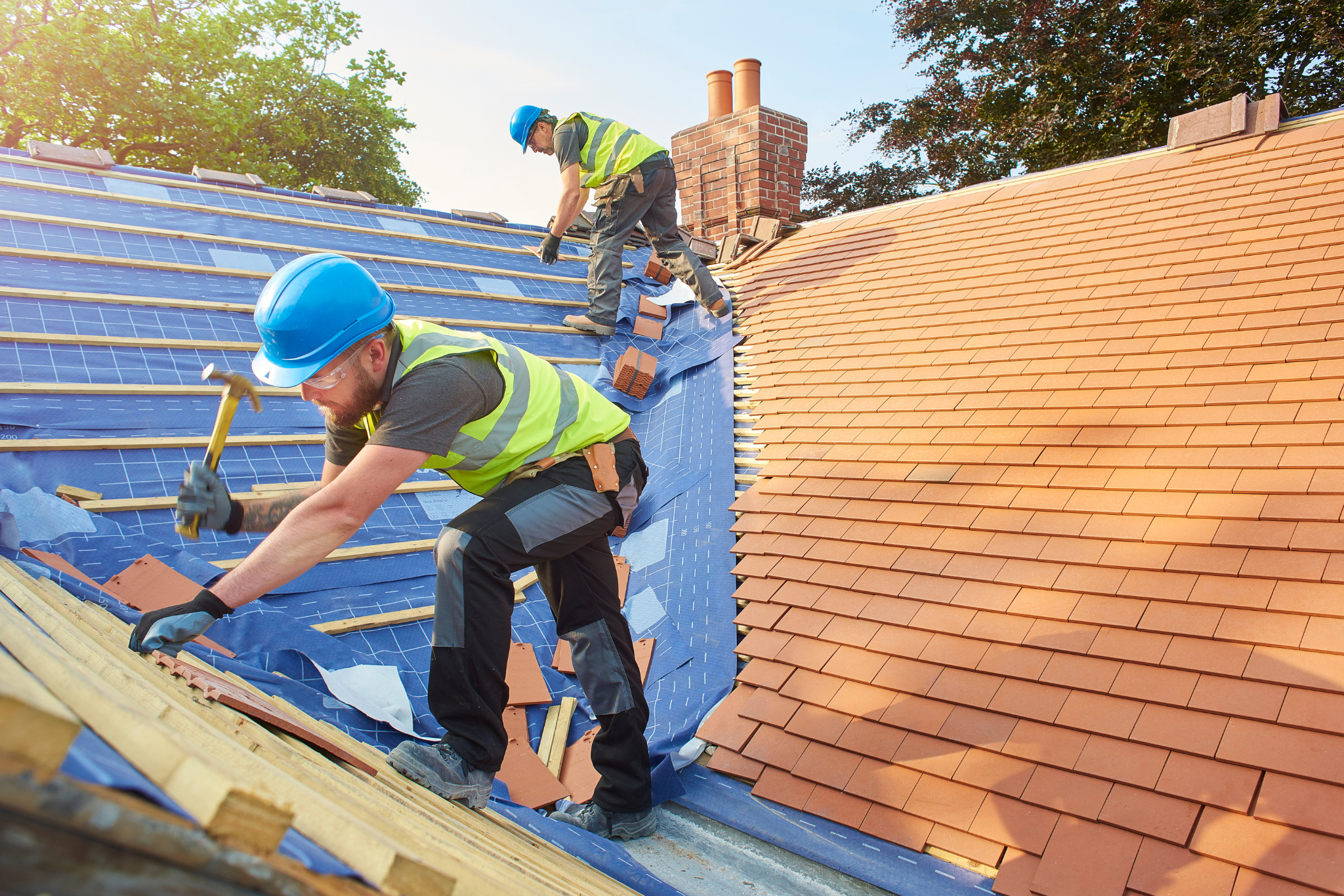 Roofing trade professionals at work