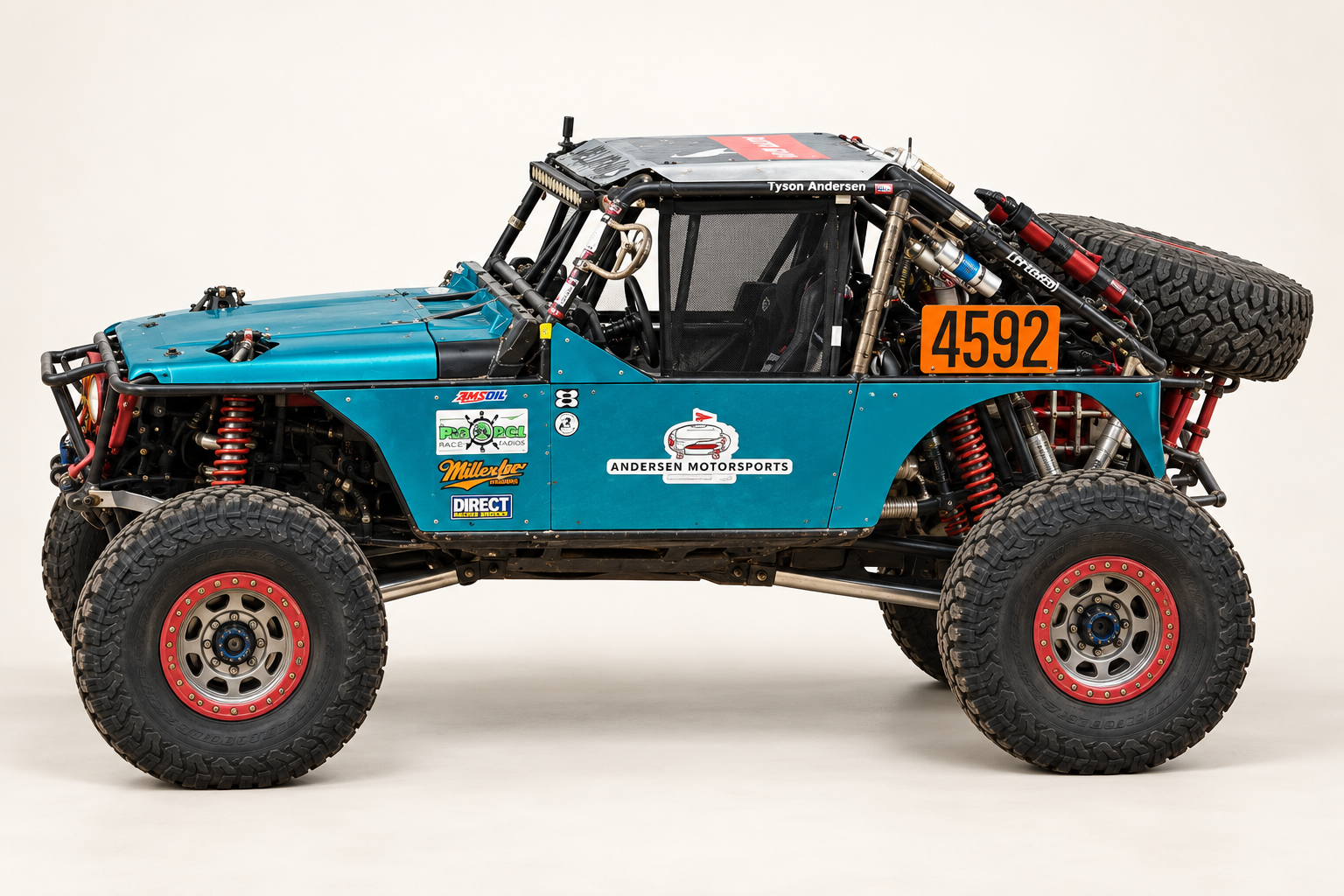 Andersen Motorsports Car #4592 left driver side profile showing blue cab door, rear bedside, and lower chassis
