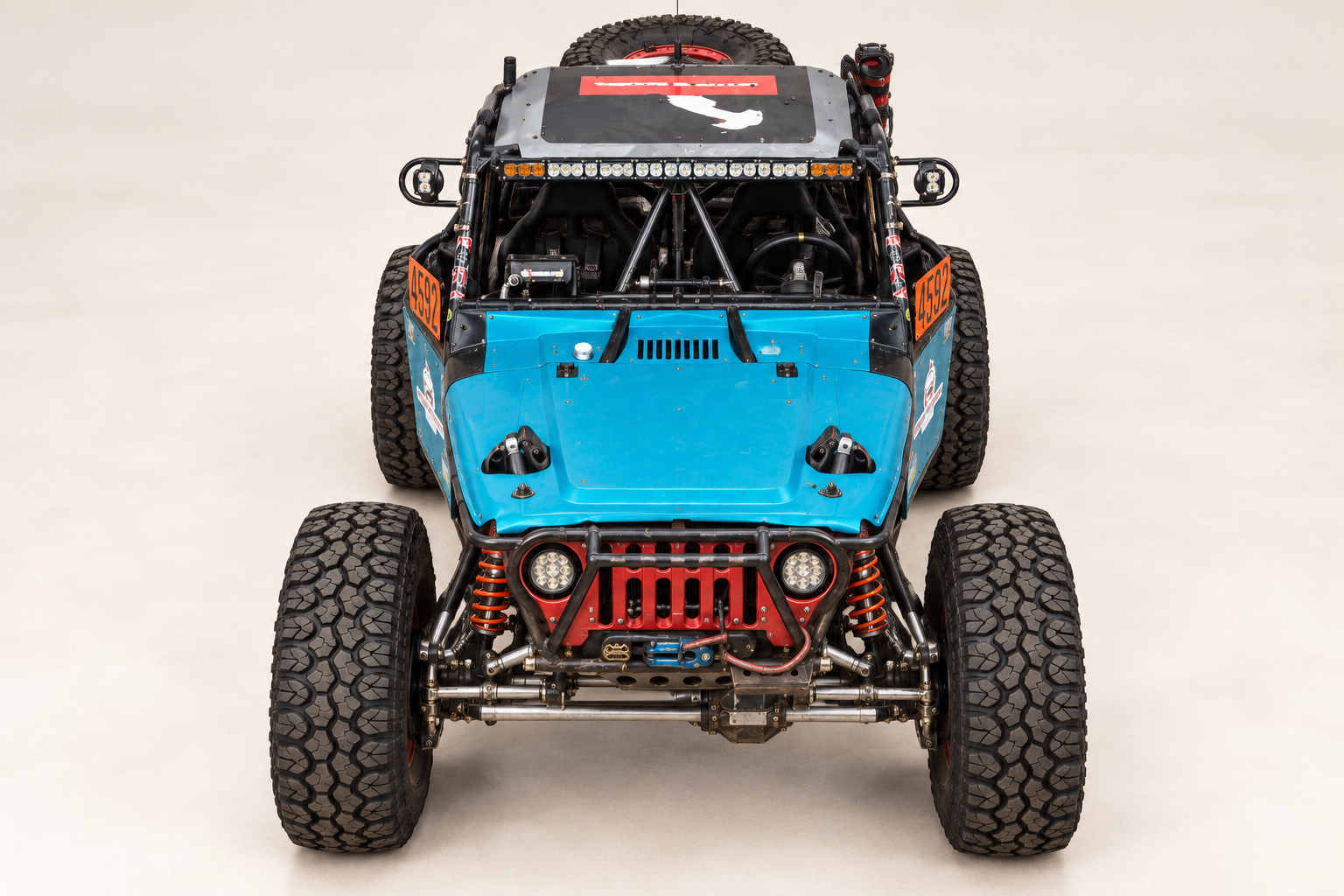Andersen Motorsports Car #4592 front view showing blue hood, red grille, LED light bar, and coilovers