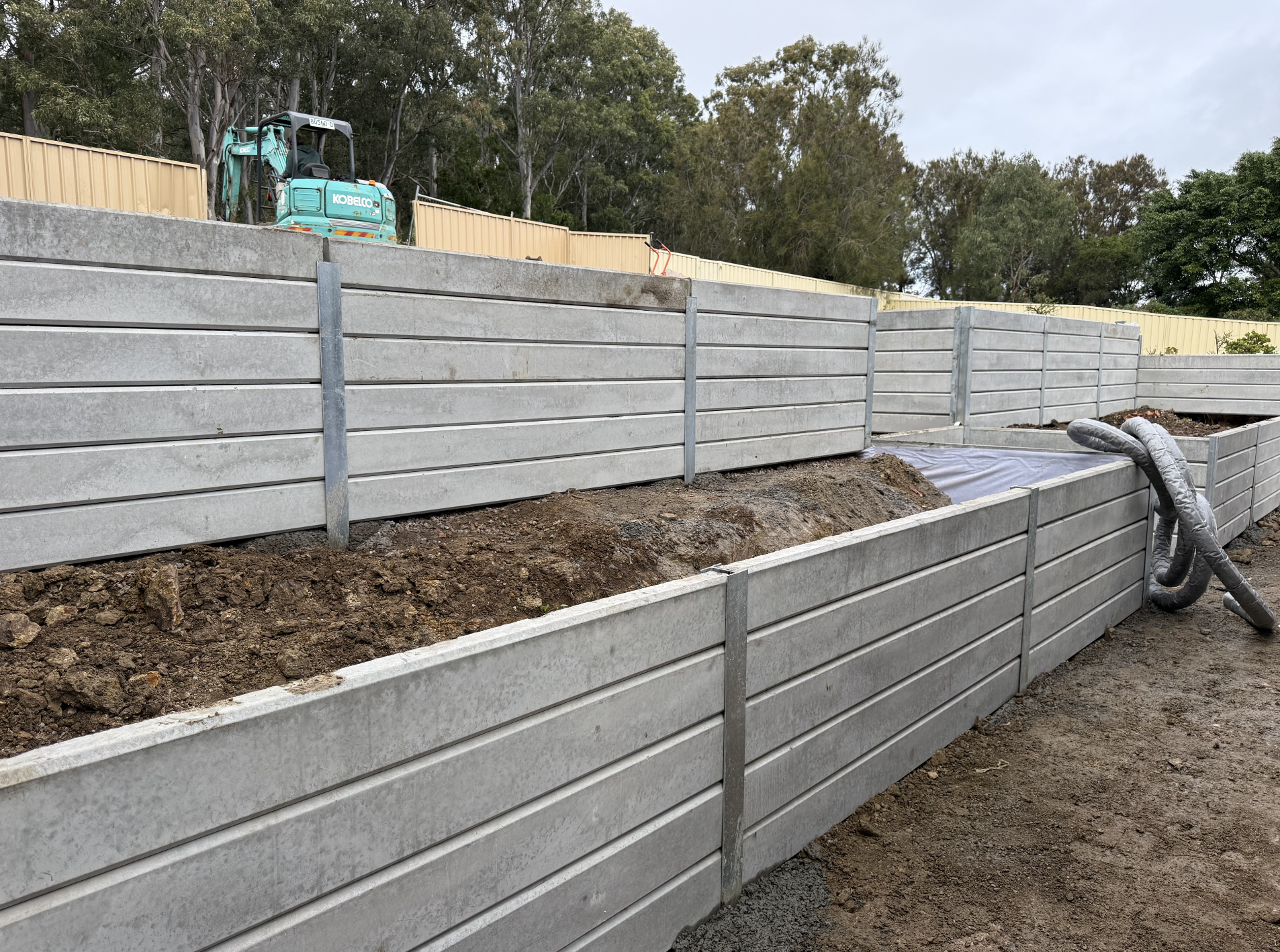 Concrete sleeper retaining walls and earthworks by Towers Carpentry and Landscaping