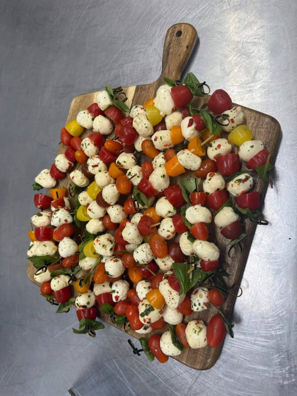 Party Display Board Loaded with Fresh Caprese Basil & Tomato Skewers