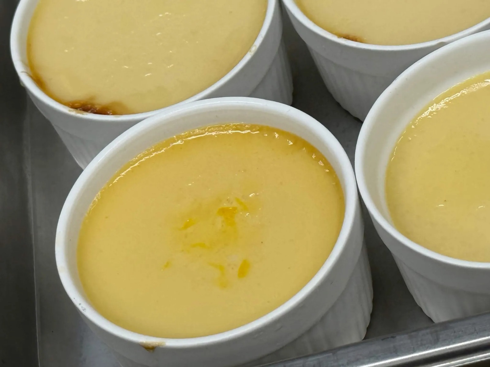 Fresh Baked Individual Vanilla Ramekin Flans Fresh from the Oven