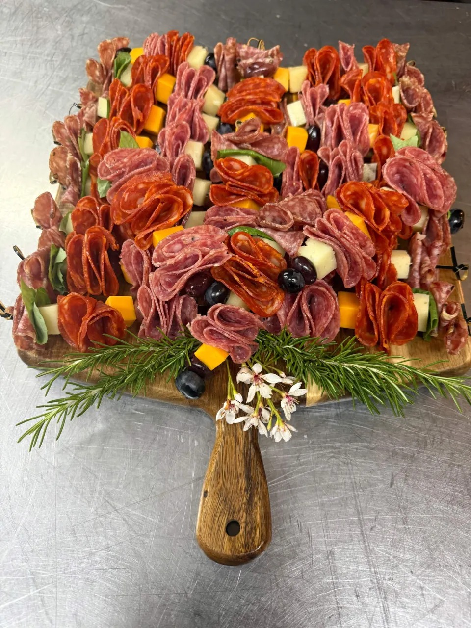 Artisan Salami, Cheese & Olive Skewers on Rustic Wood Paddle Board
