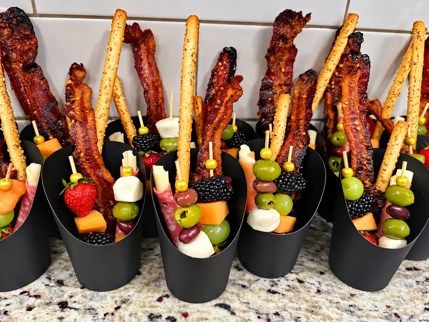 Hospitality appetizers and gourmet charcuterie skewers prepared for retreat guests