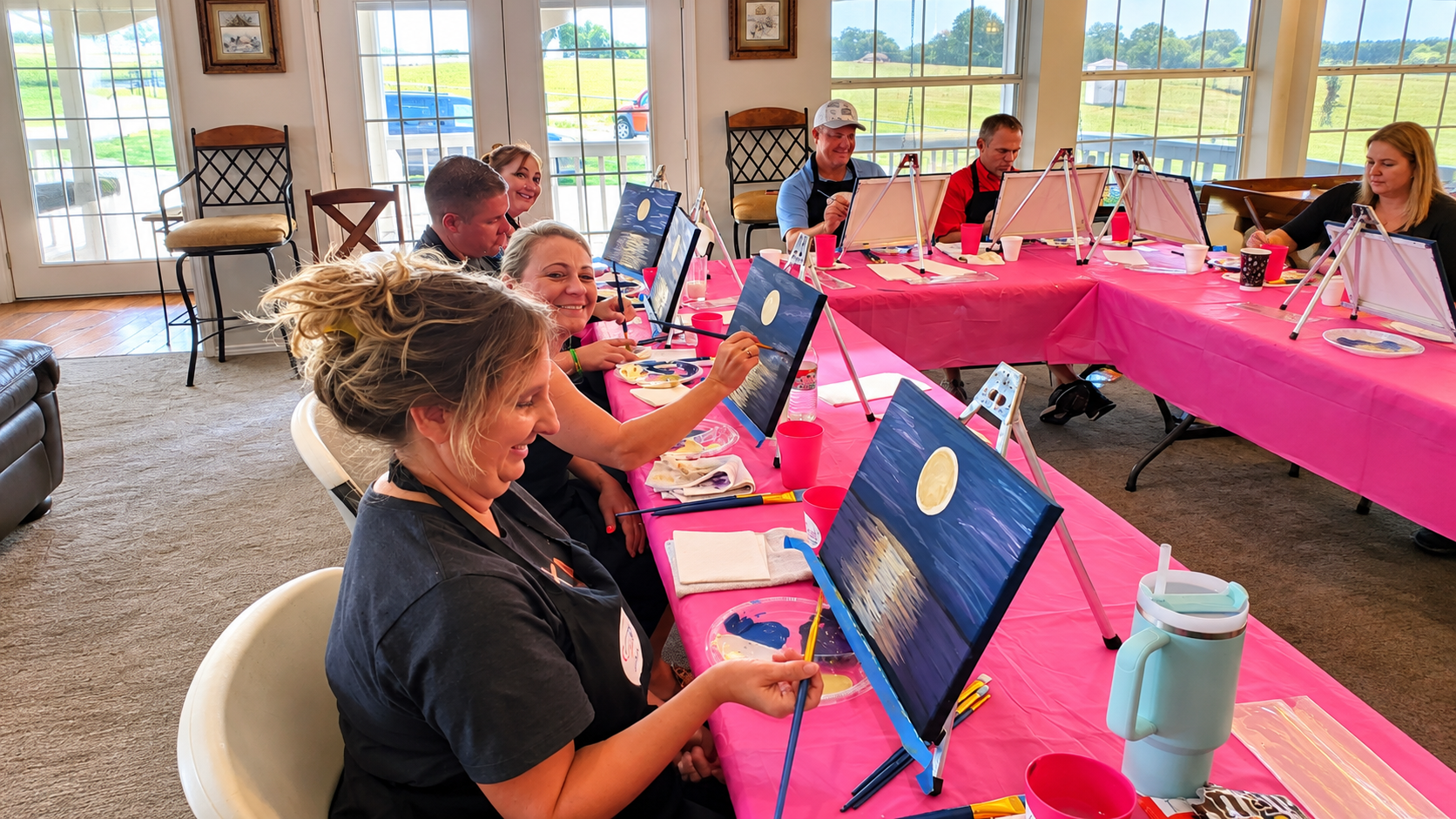 Pastors and spouses connecting and painting together during an Encounter retreat activity