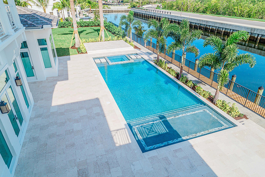 Overhead view of a completed South Florida pool remodel showing the pool perimeter, coping, and surrounding hardscape deck area