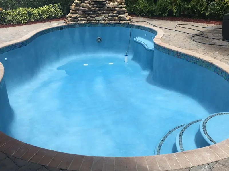 Recently resurfaced swimming pool during the refill and initial startup stage