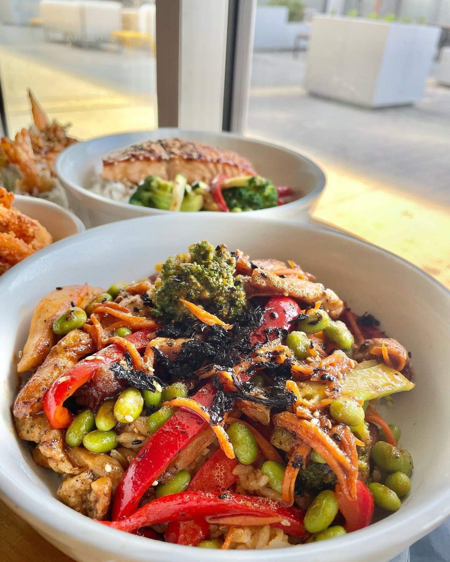 Loaded teriyaki bowl with edamame, charred red peppers, broccoli, and toasted seaweed flakes at Nori in Omaha