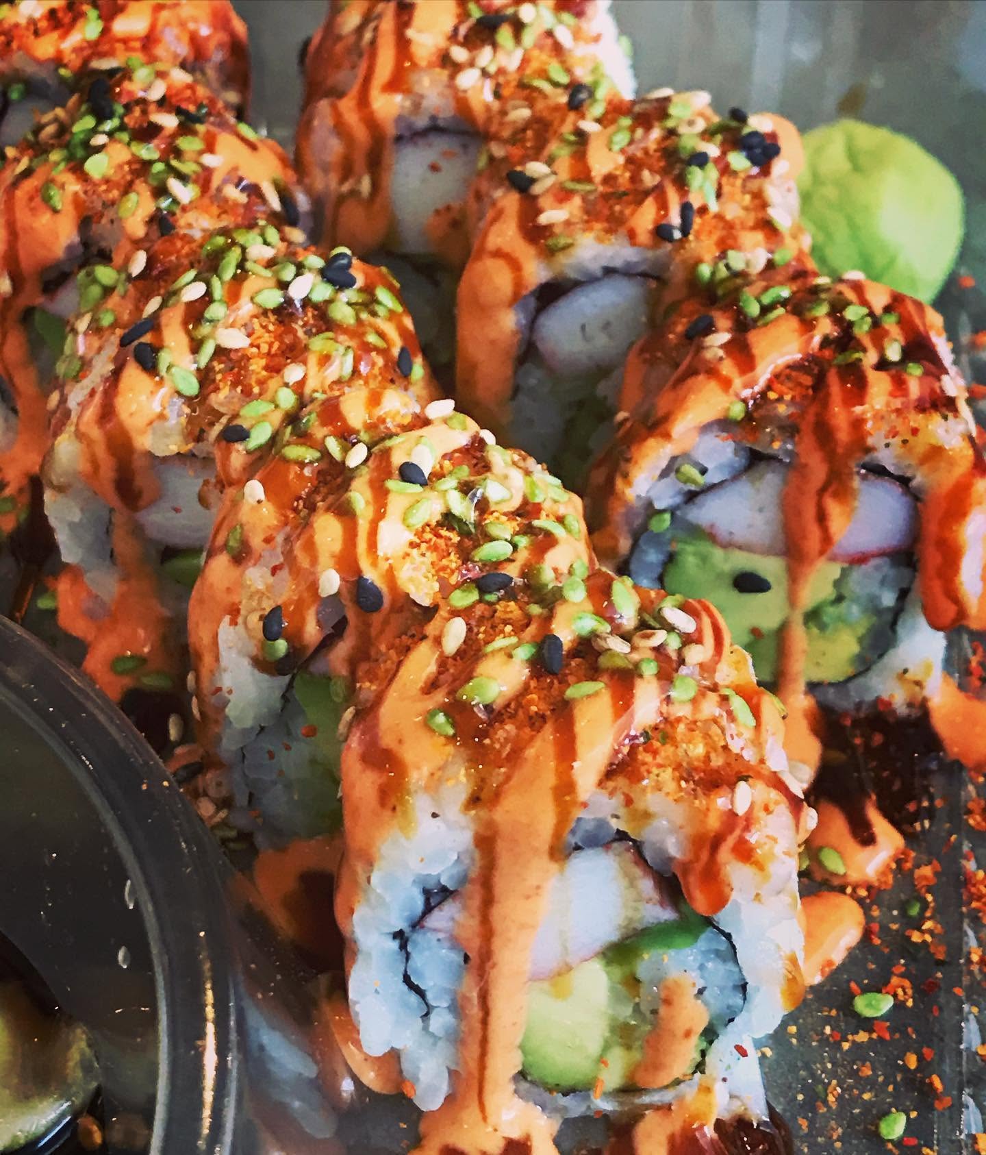 Fresh spicy sushi roll drizzled with house spicy mayo, eel sauce, and toasted sesame seeds at Nori in Omaha