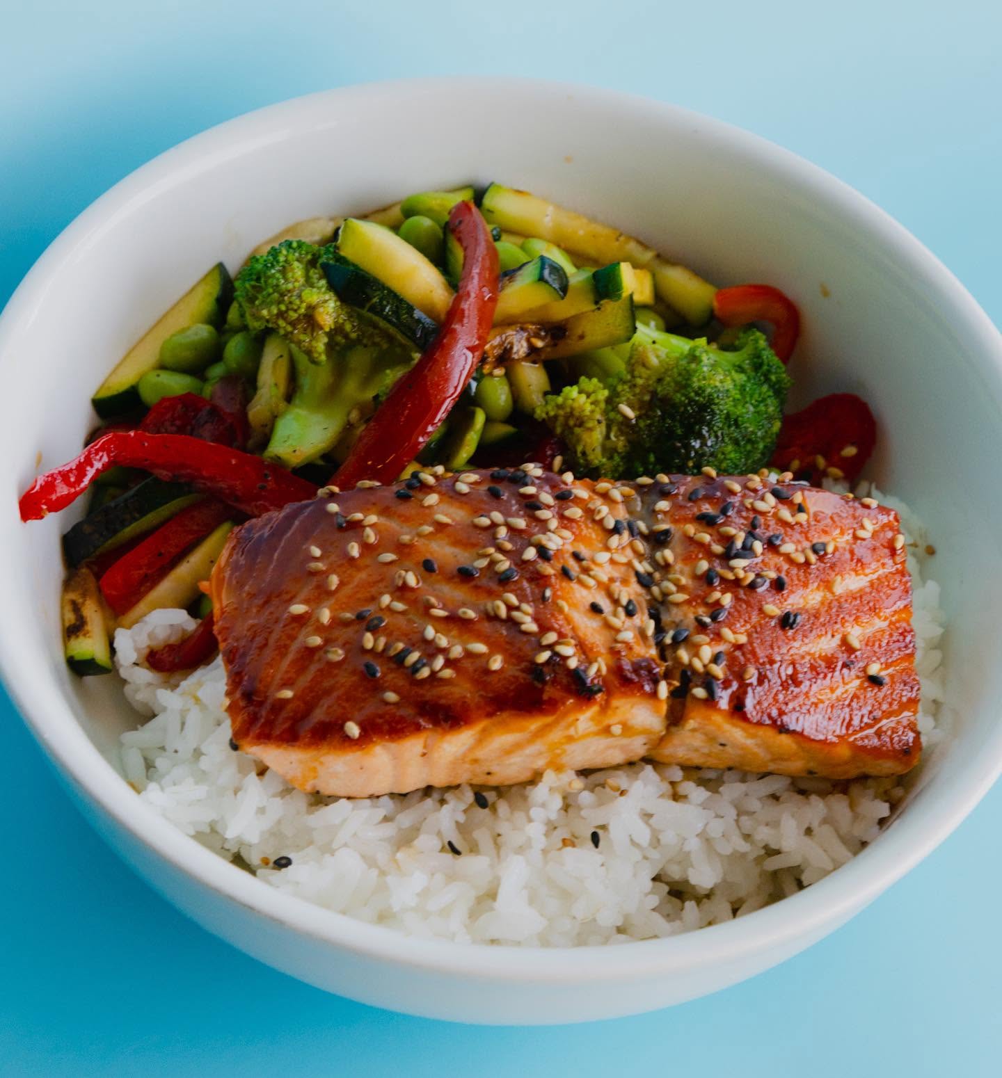 Glazed salmon teriyaki over steamed white rice with grilled vegetables at Nori in Omaha