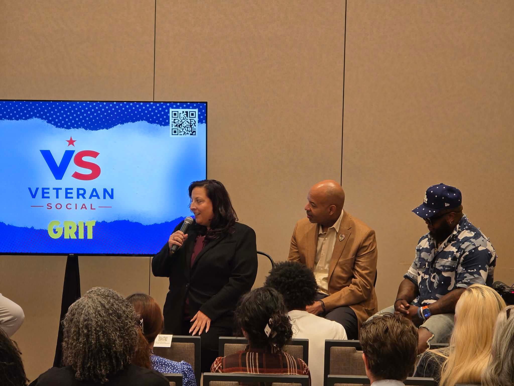 Speakers coming together in solidarity during the GRIT panel activation