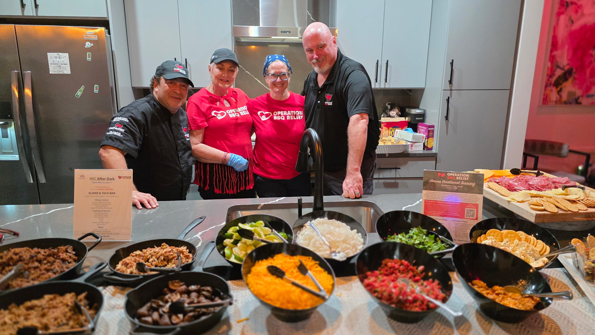 Operation BBQ Relief team hosting the culinary spread at Veteran Social After Dark