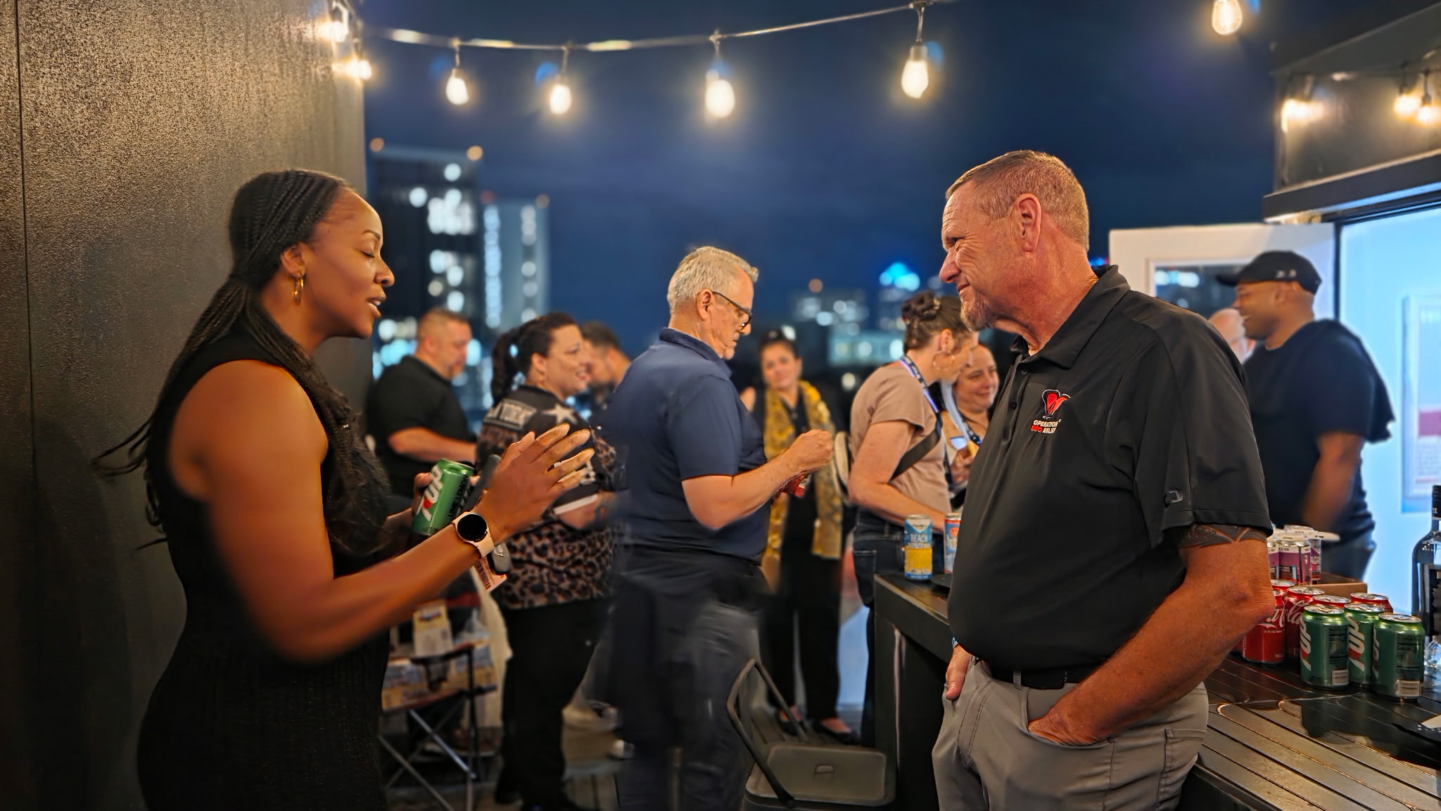 Meaningful conversations under city string lights at Veteran Social After Dark