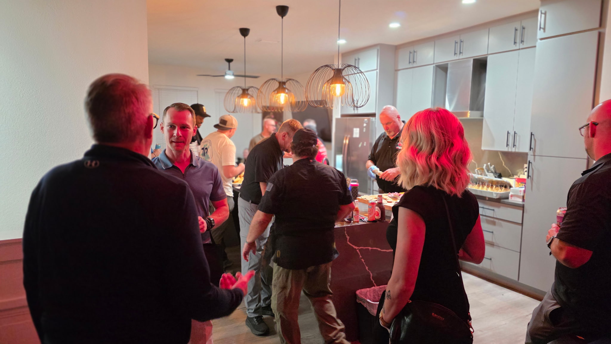 Breaking bread and fellowship in the kitchen during After Dark Tampa