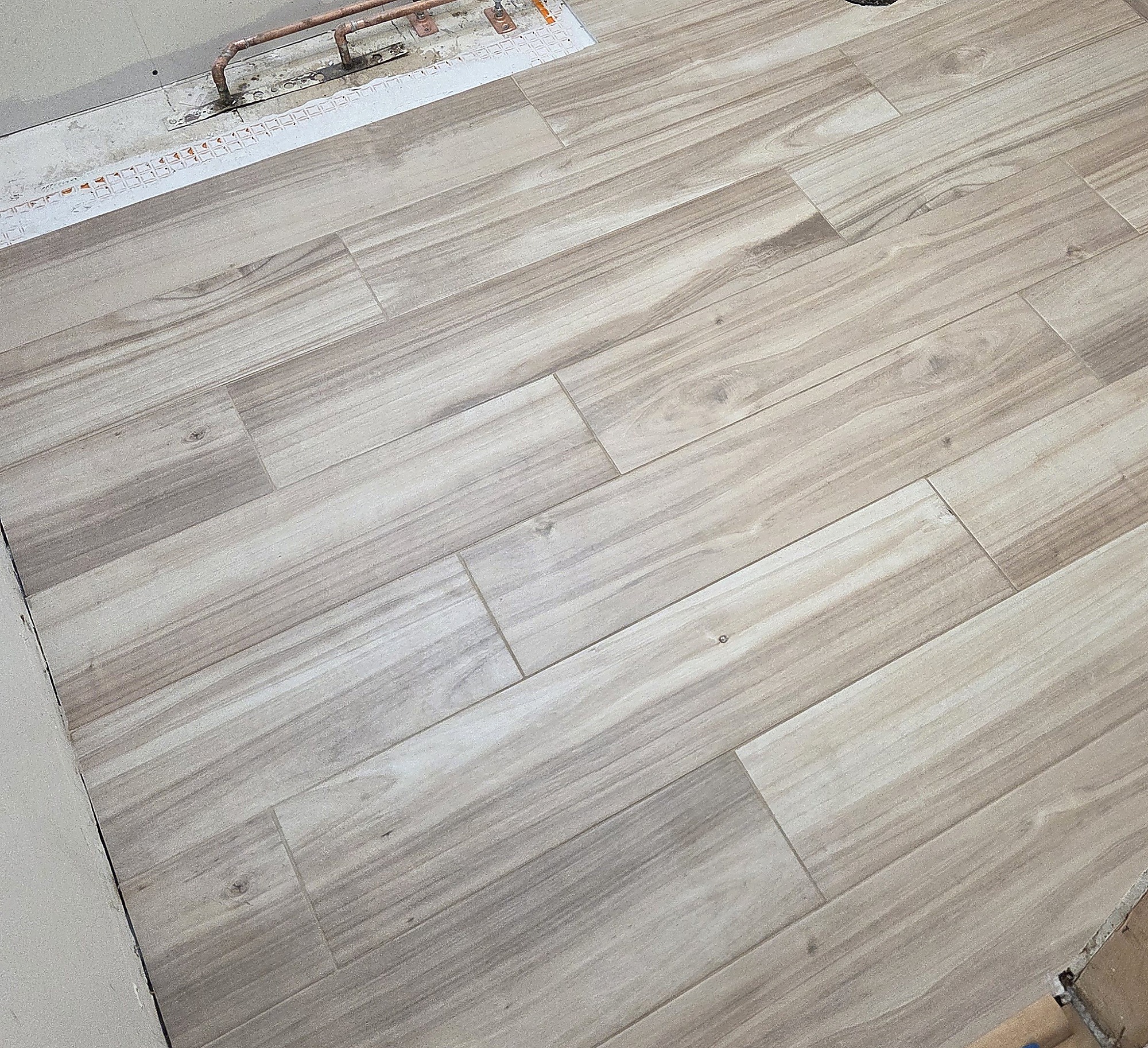 Wood-look tile flooring in a bathroom