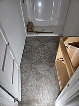Tile-look luxury vinyl tile in a bathroom entry