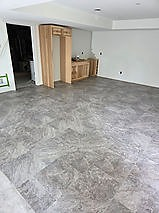 Glue-down grouted luxury vinyl tile in a finished basement