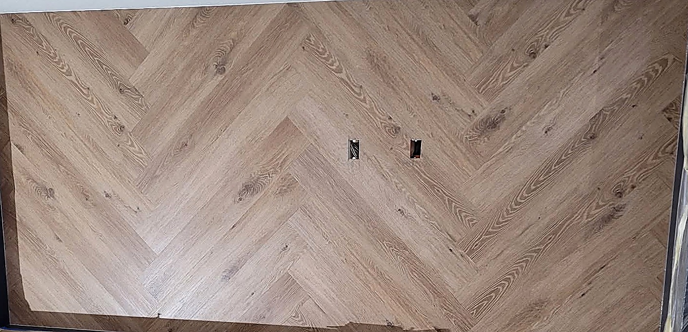 Herringbone wood-look plank accent wall