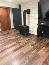 Laminate wood flooring beside a woodstove