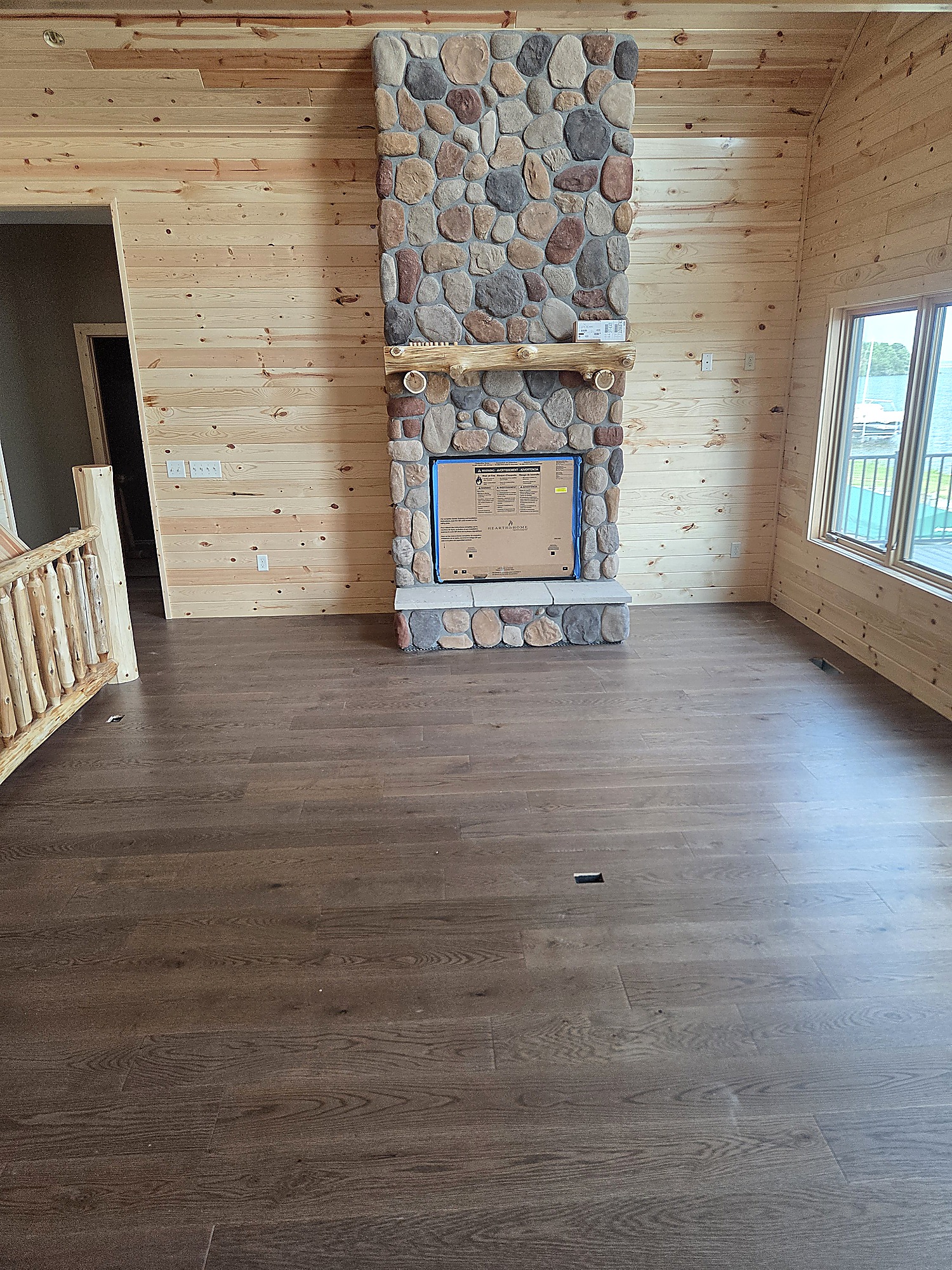 Wood-look plank flooring in a kitchen with dark cabinets