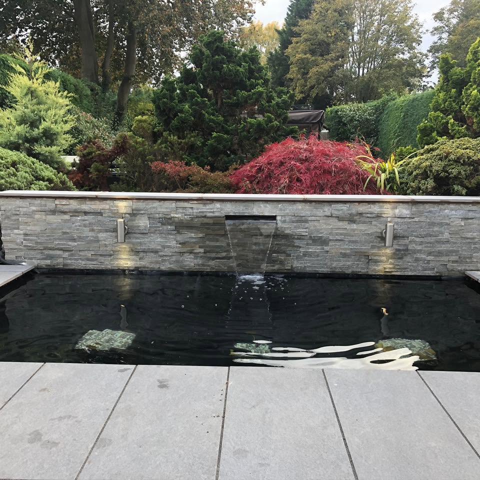 Split-face stone walling with water feature