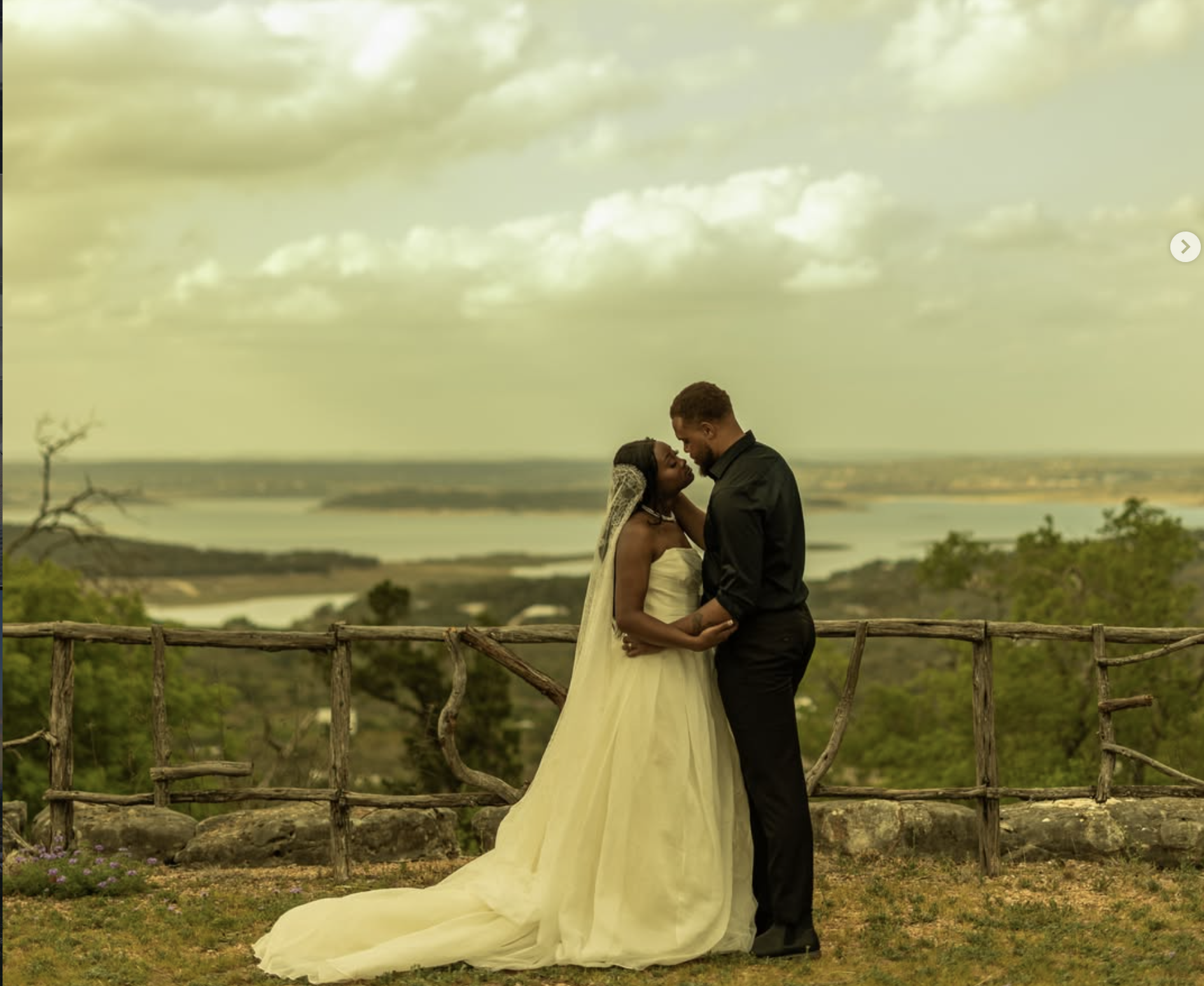 Bride and groom embracing at the rustic cedar LOVE overlook above Canyon Lake