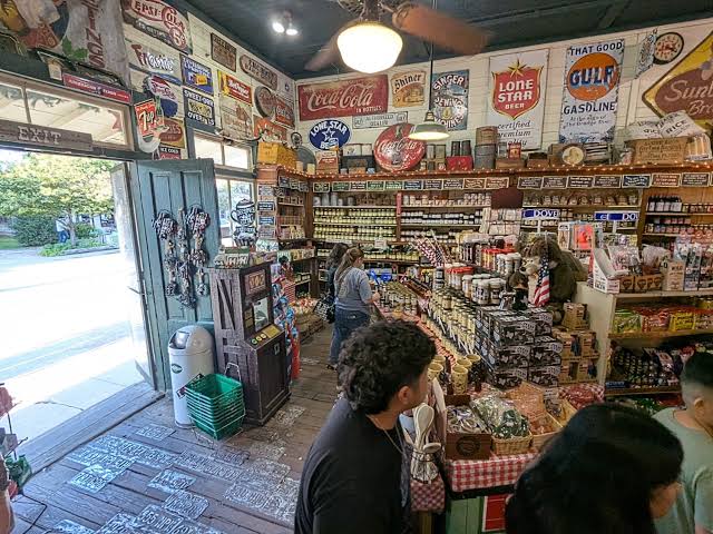 Inside the historic Gruene General Store with vintage Texas signs, canned goods, and Hill Country gifts in the Gruene Historic District