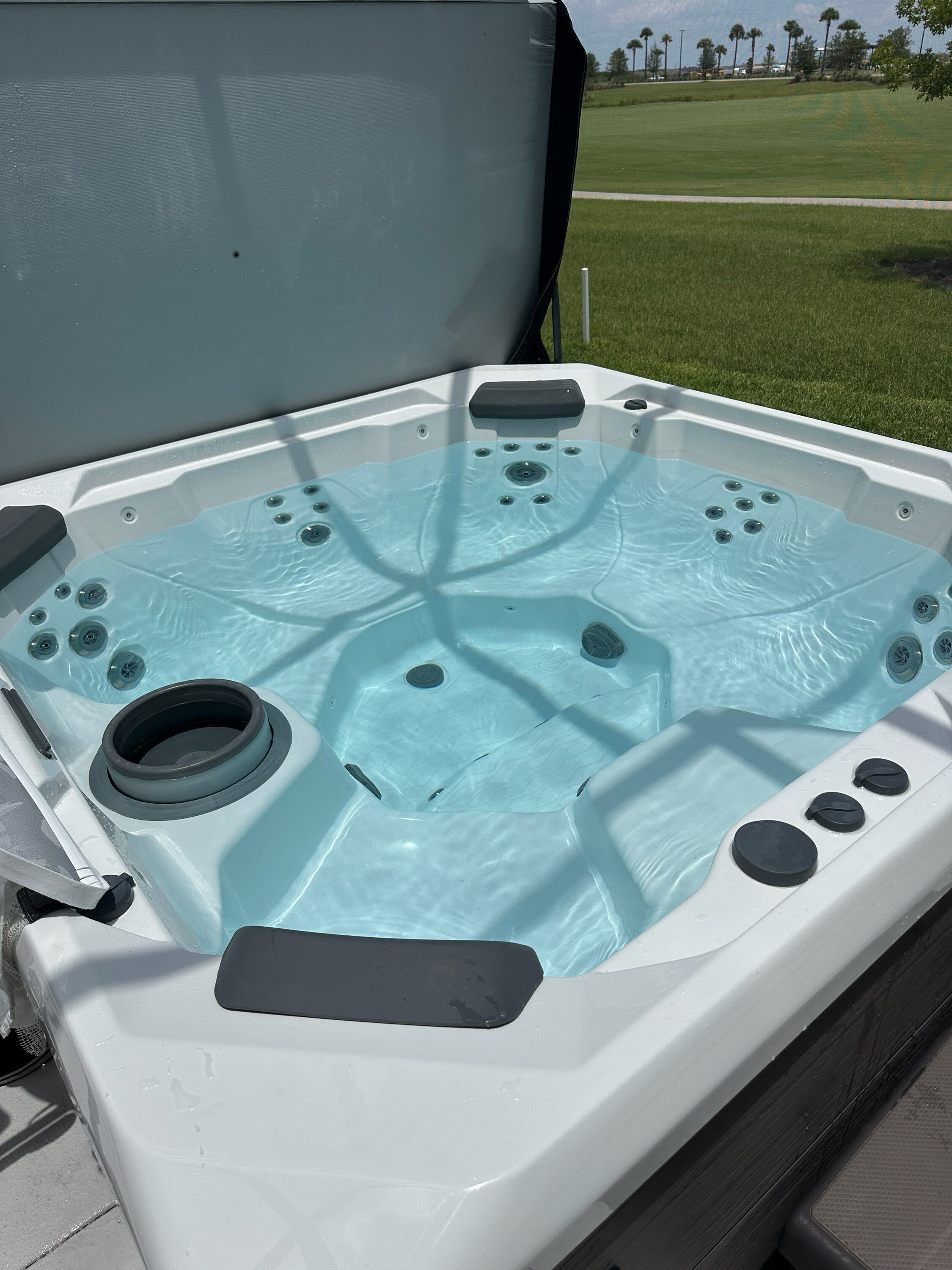 Clean Baywatch Pools client hot tub during maintenance