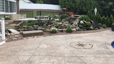 Stamped Concrete Patio & Multi-Tier Waterfall