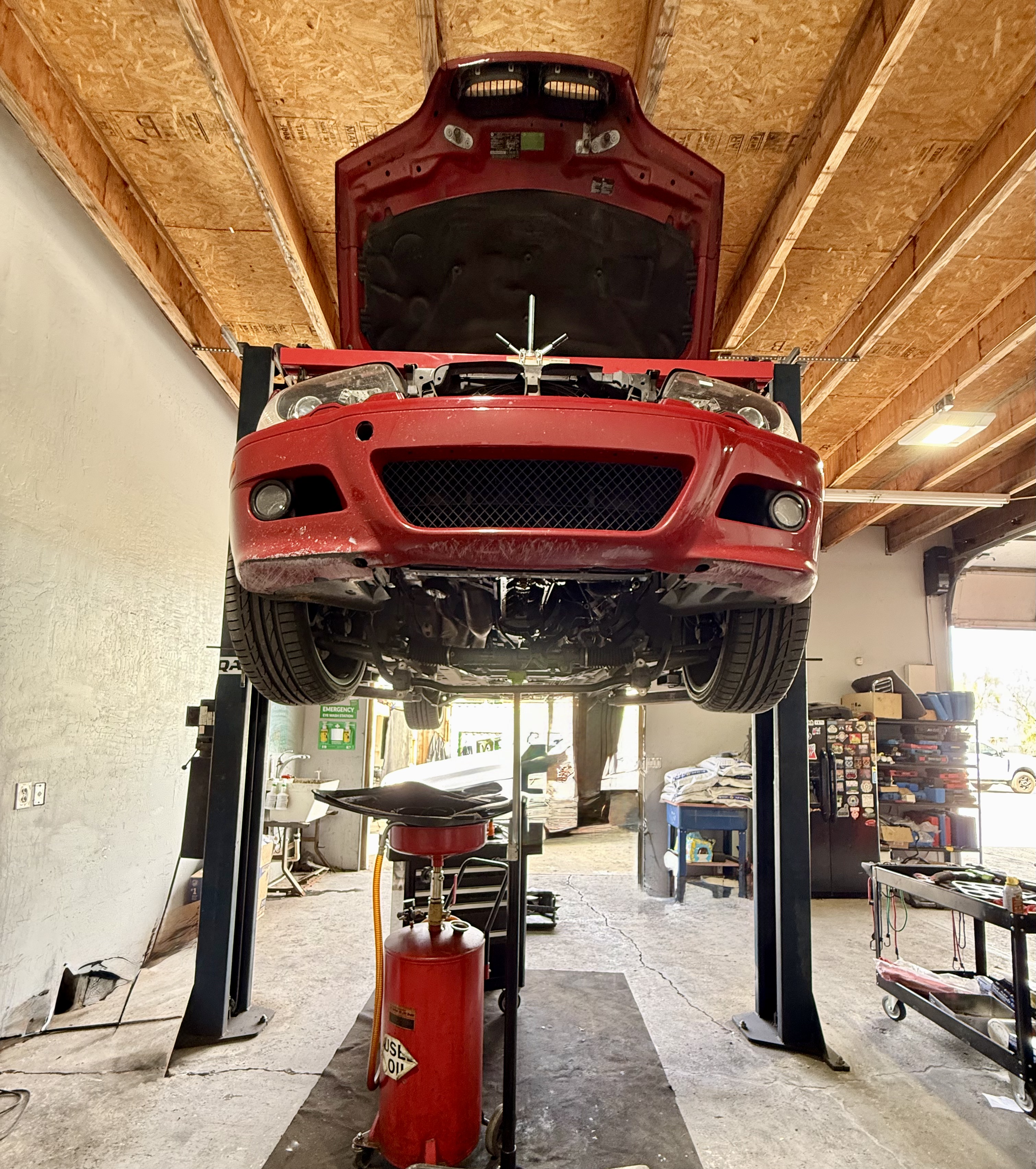 BMW being serviced on a lift at State 48 Autohaus in Phoenix