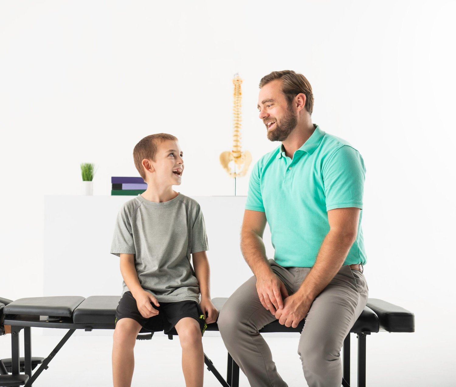 Dr. Scott Kirchner talking with a young patient