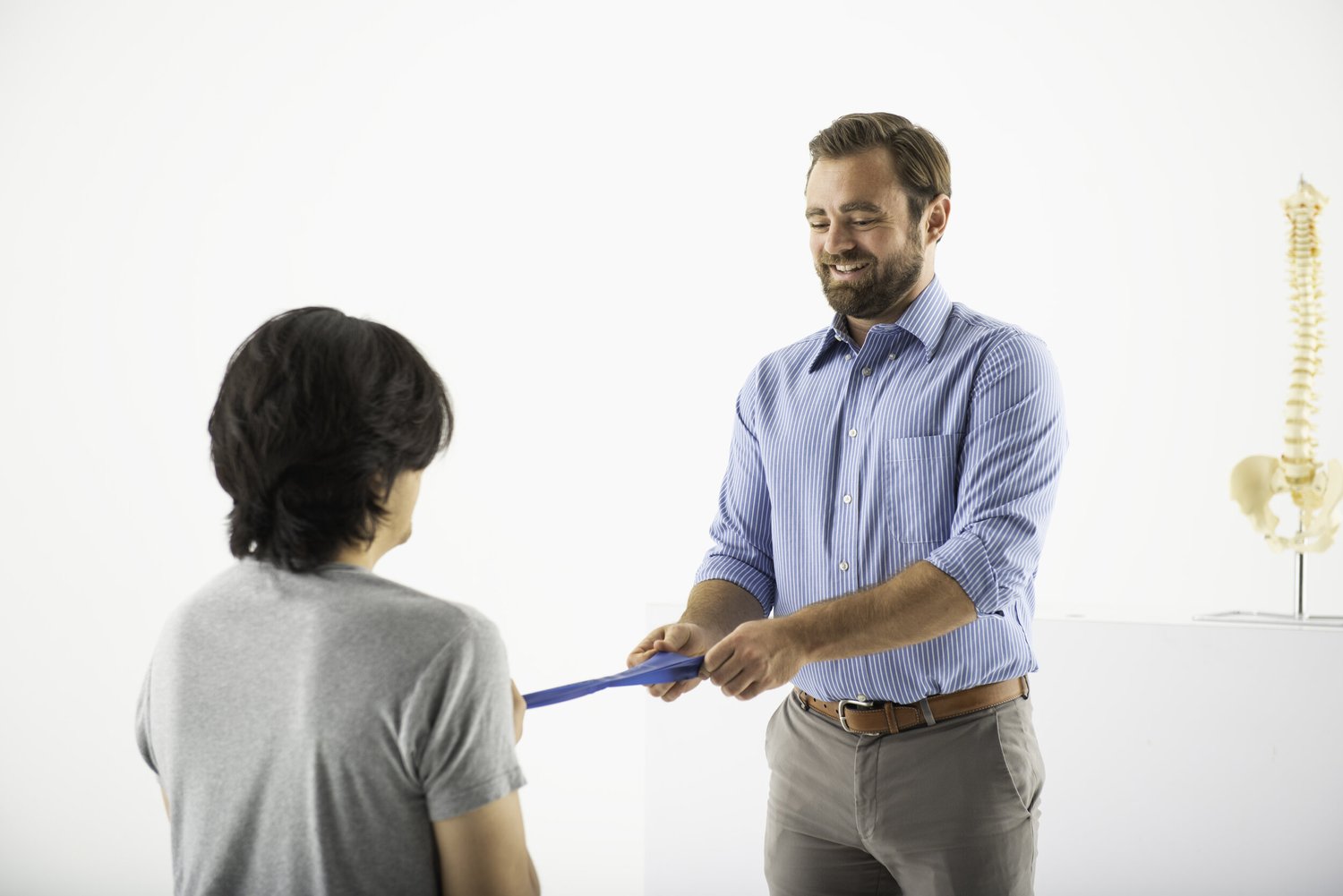 Dr. Scott Kirchner guiding a resistance-band exercise