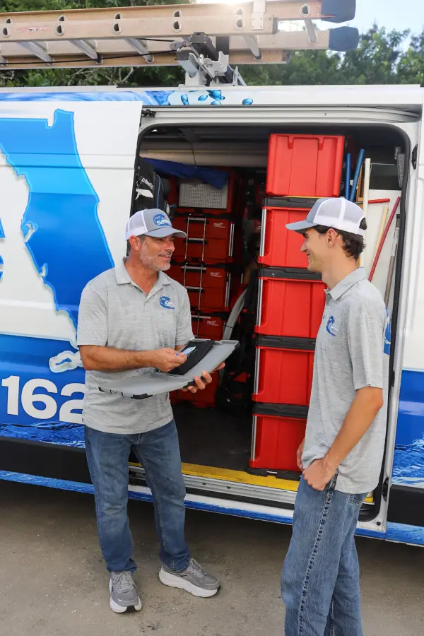 Florida Plumbing Plus plumbing technicians at service van